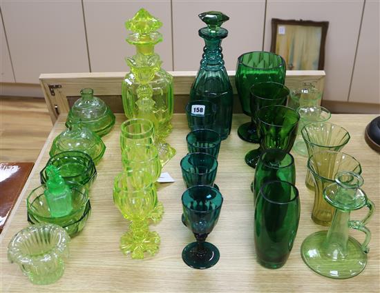 A Victorian Vaseline glass decanter and stopper, a green glass decanter and stopper and similar items tallest 32cm